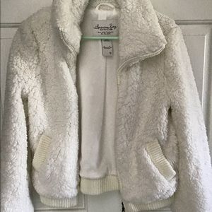 White long sleeve zip up jacket.